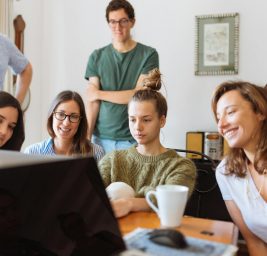 people looking at laptop computer