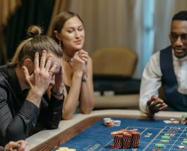 a person loosing his bets in roulette table