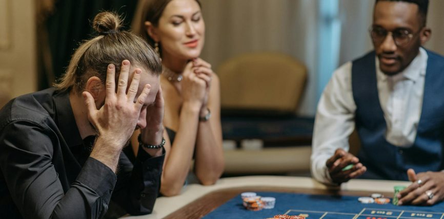 a person loosing his bets in roulette table